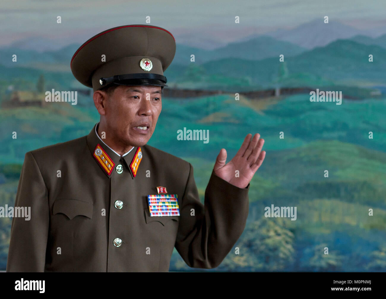 North Korean military officer in the section wall of the Demilitarized ...
