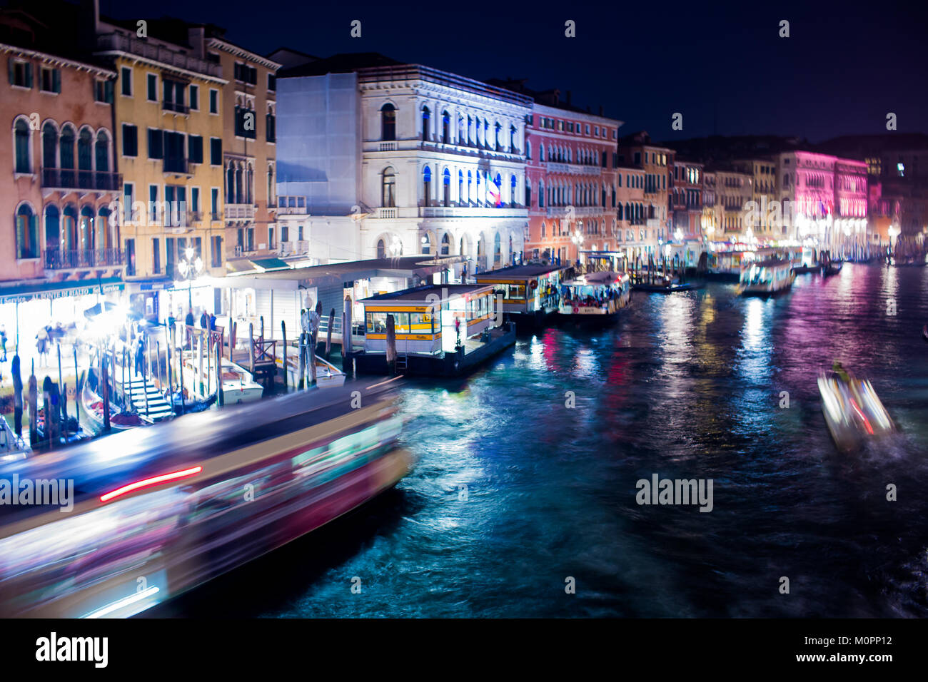 Boats and gondolas in the Grand Canal at night in Venice Stock Photo ...
