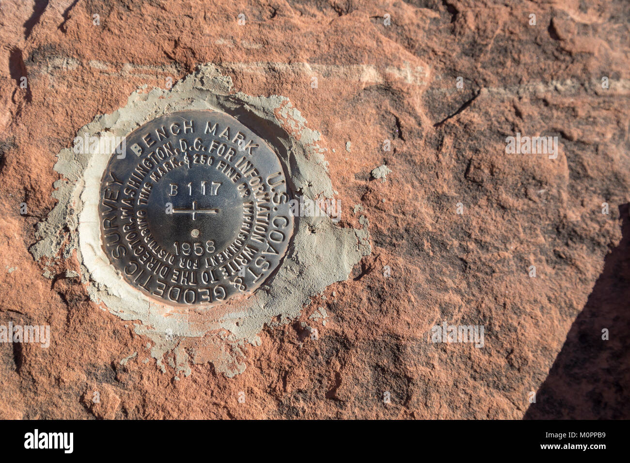 Blanding, Utah - A bench mark places by the U.S. National Geodetic Survey in Mule Canyon in Bears Ears National Monument Stock Photo