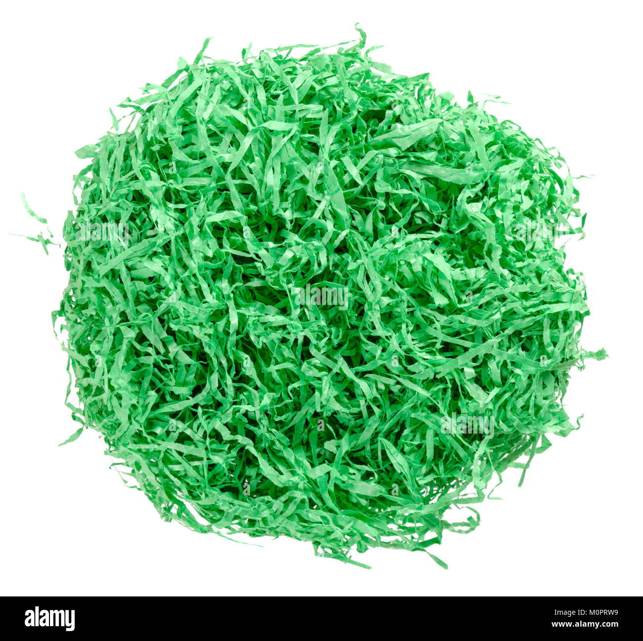 Green paper Easter grass nest from above. Colored crinkle grass. Gift basket shred and filler. Decoration. Stock Photo