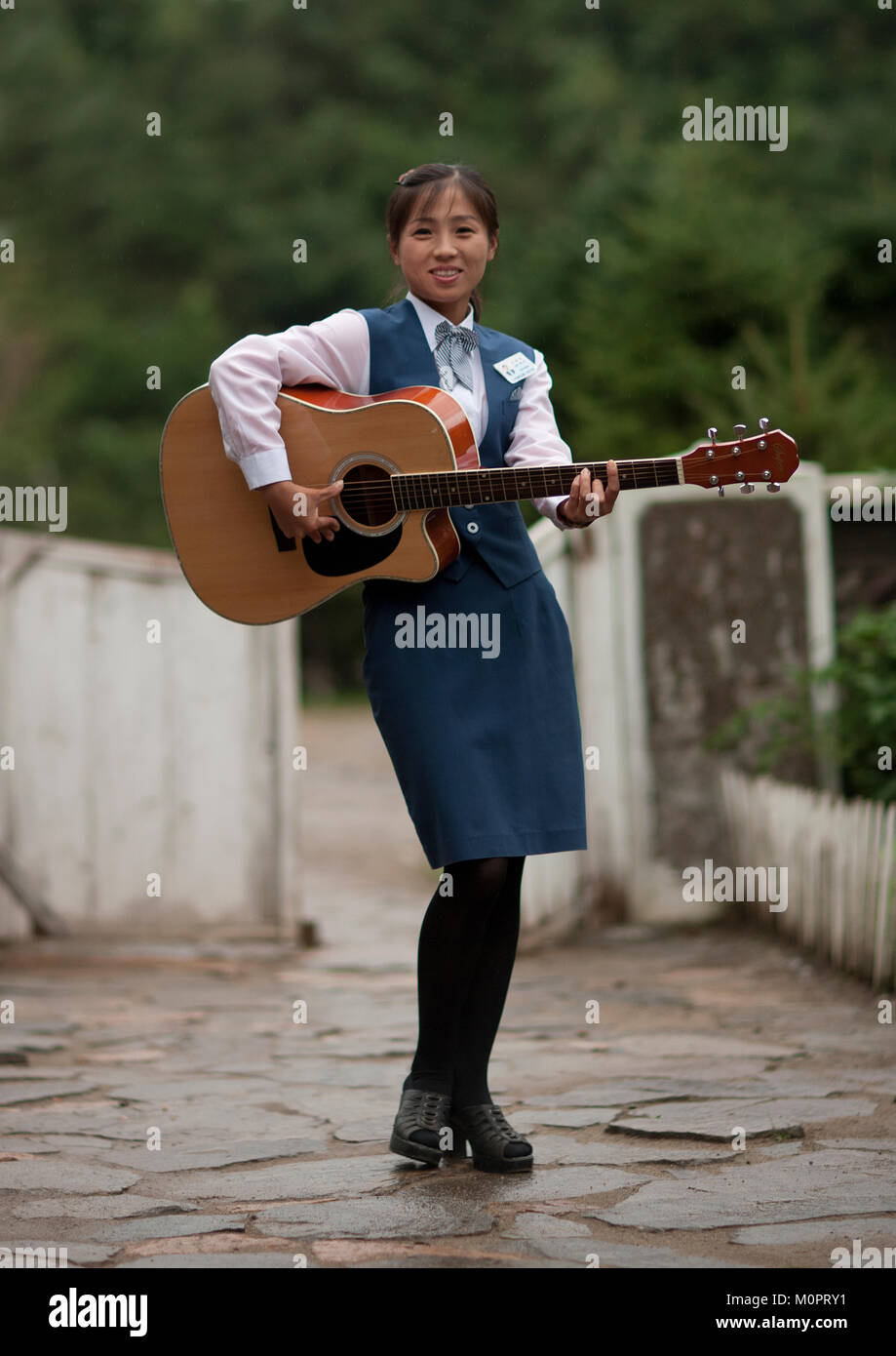 North Korean woman playing guitar, North Hamgyong Province, Jung Pyong Ri,  North Korea Stock Photo - Alamy