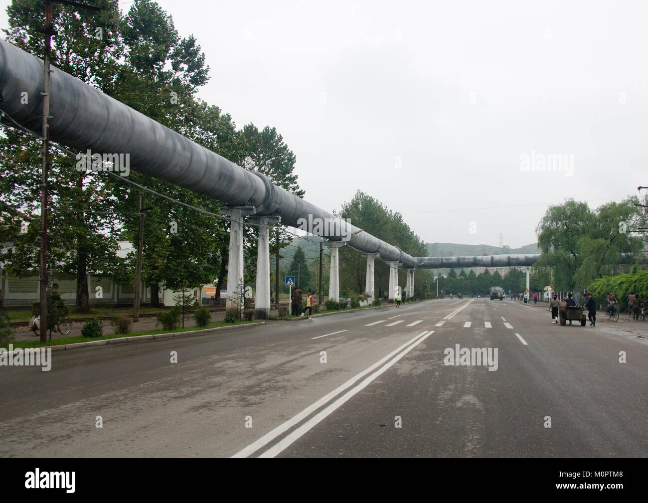 Giant pipe for heating alongside an empty road, South Hamgyong Province, Hamhung, North Korea