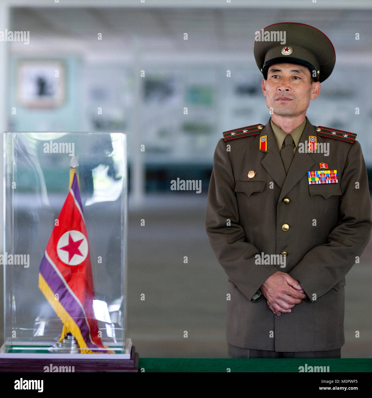 North Korean colonel in front of the armistice document in the North Korea peace museum, North Hwanghae Province, Panmunjom, North Korea Stock Photo