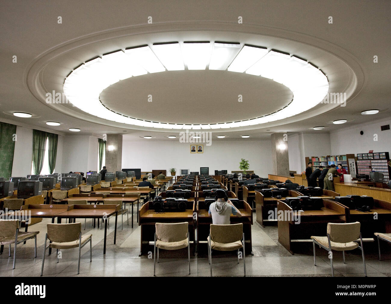 Multimedia room of the Grand people's study house with the offcial portraits of the Dear Leaders