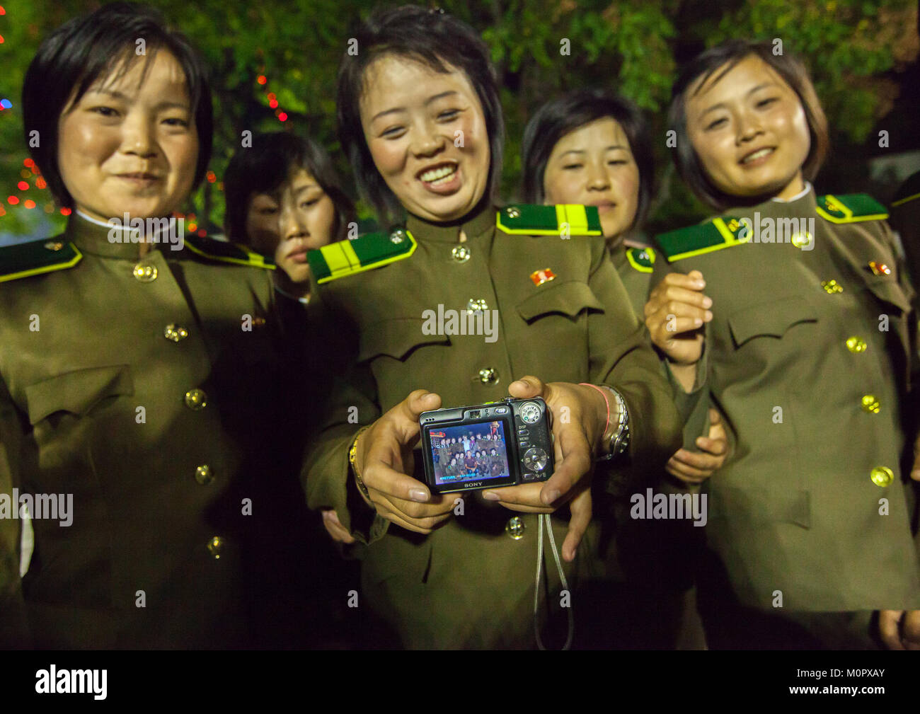 North Korean women soldiers showing a camera screen, Pyongan Province