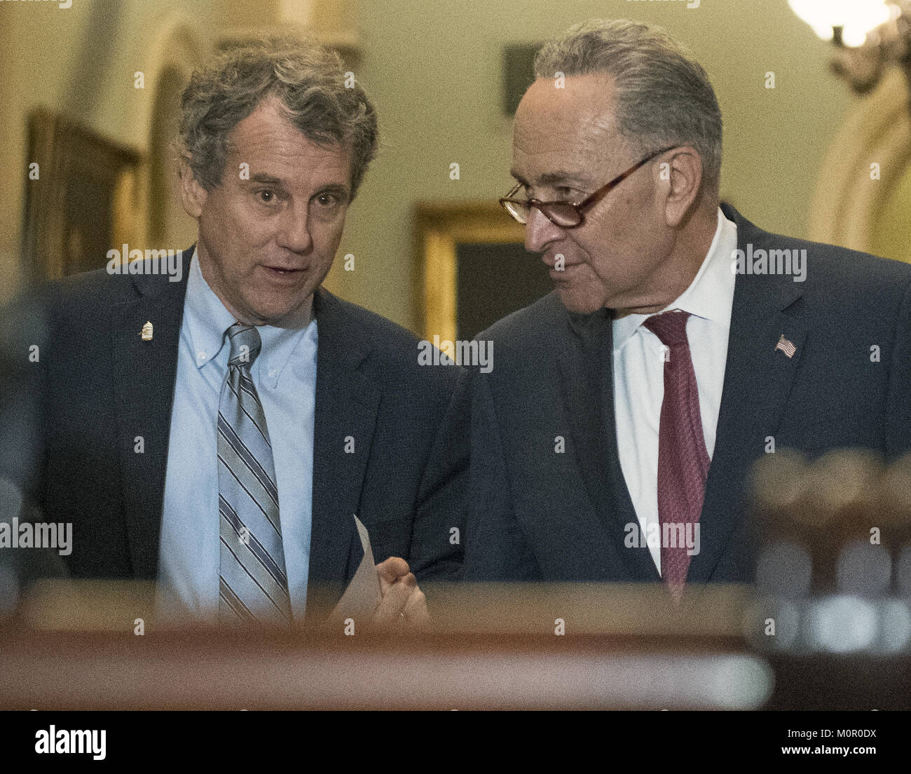 Washington, District of Columbia, USA. 23rd Jan, 2018. United States Senate Majority Leader Chuck Schumer (Democrat of New York), right, US Senator Sherrod Brown (Democrat of Ohio), left, speak prior to making remarks following the Democratic Party policy luncheon in the US Capitol in Washington, DC on Tuesday, January 23, 2018.Credit: Ron Sachs/CNP Credit: Ron Sachs/CNP/ZUMA Wire/Alamy Live News Stock Photo