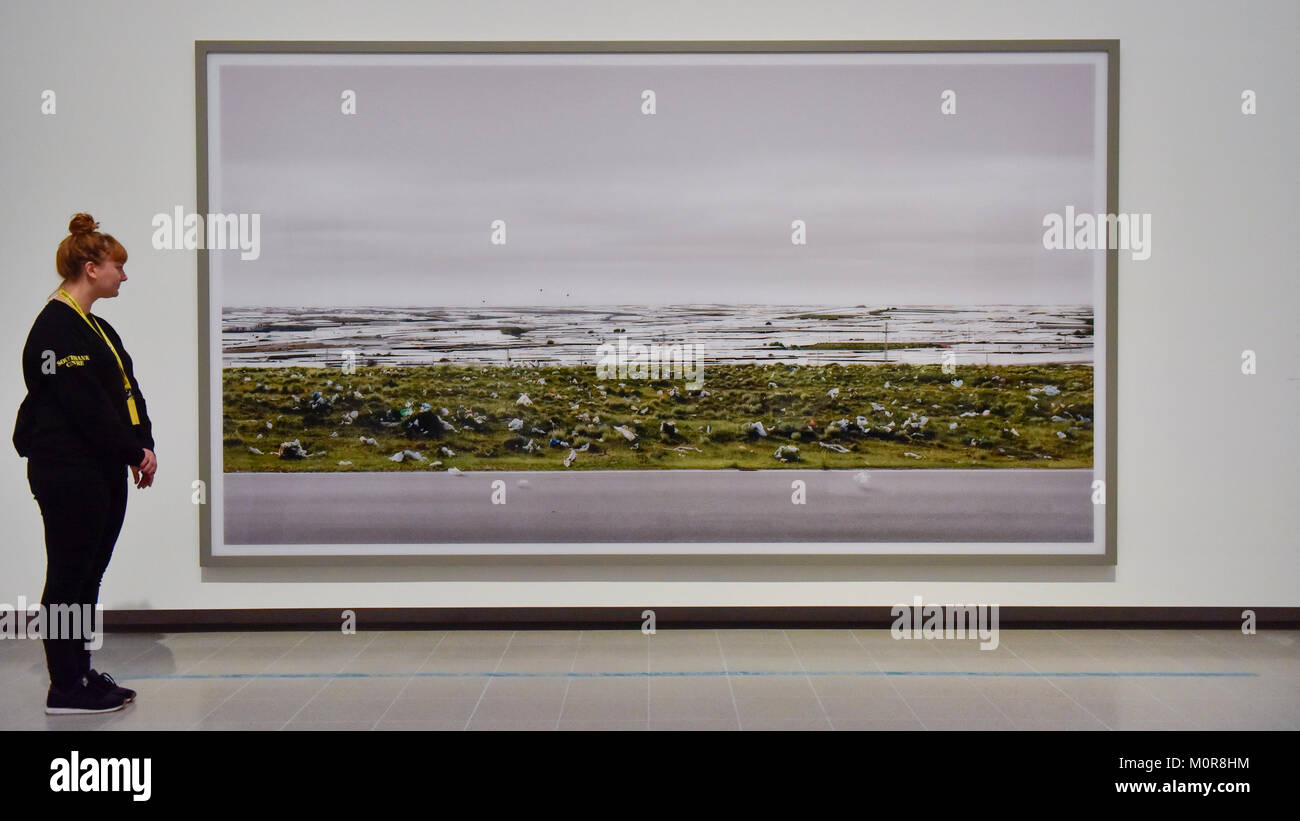 London, UK. 24 January 2018. A staff member views "El Ejido", 2017, by Andreas  Gursky. Preview of "Andreas Gursky", the first major UK retrospective by  the acclaimed German photographer at the newly