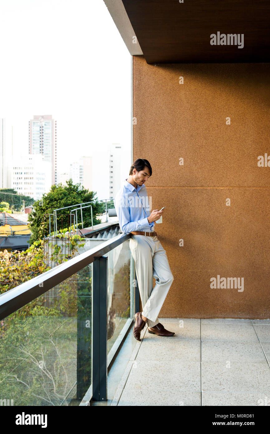 Person standing on balcony high rise hi-res stock photography and ...