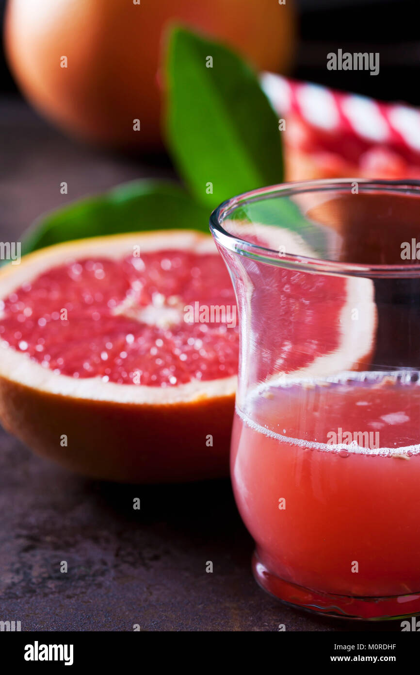 Glass of red grapefruit juice Stock Photo - Alamy