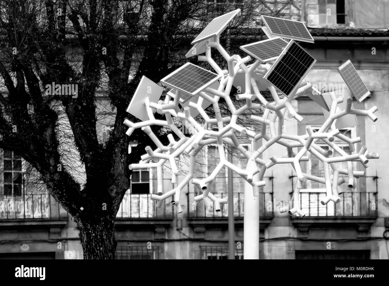 solar panels supply with energy  a tree shaped mobile charger and WiFi antenna in the main square of Braga, a city in the north of Portugal Stock Photo