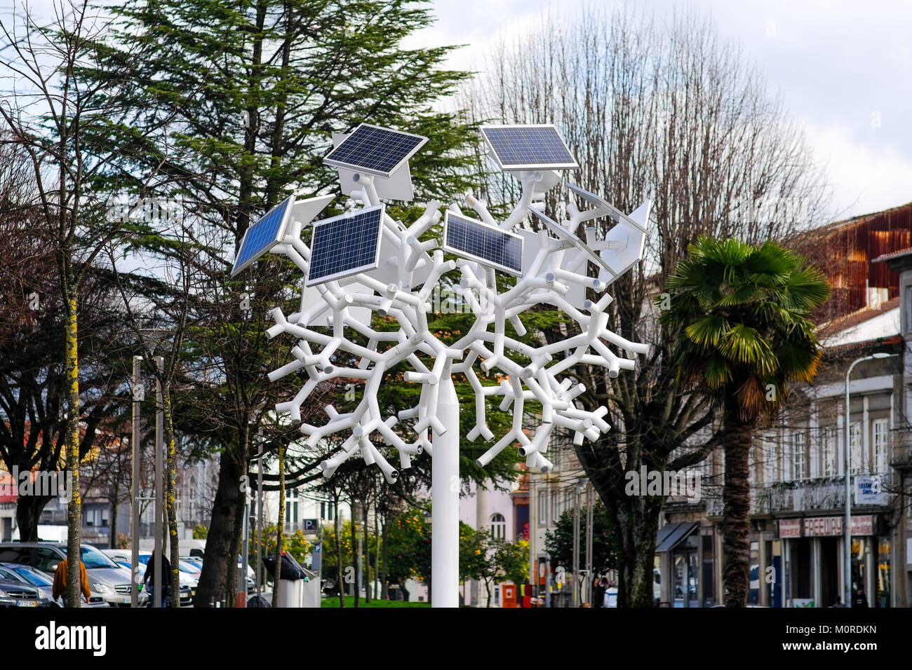 solar panels supply with energy  a tree shaped mobile charger and WiFi antenna in the main square of Braga, a city in the north of Portugal Stock Photo