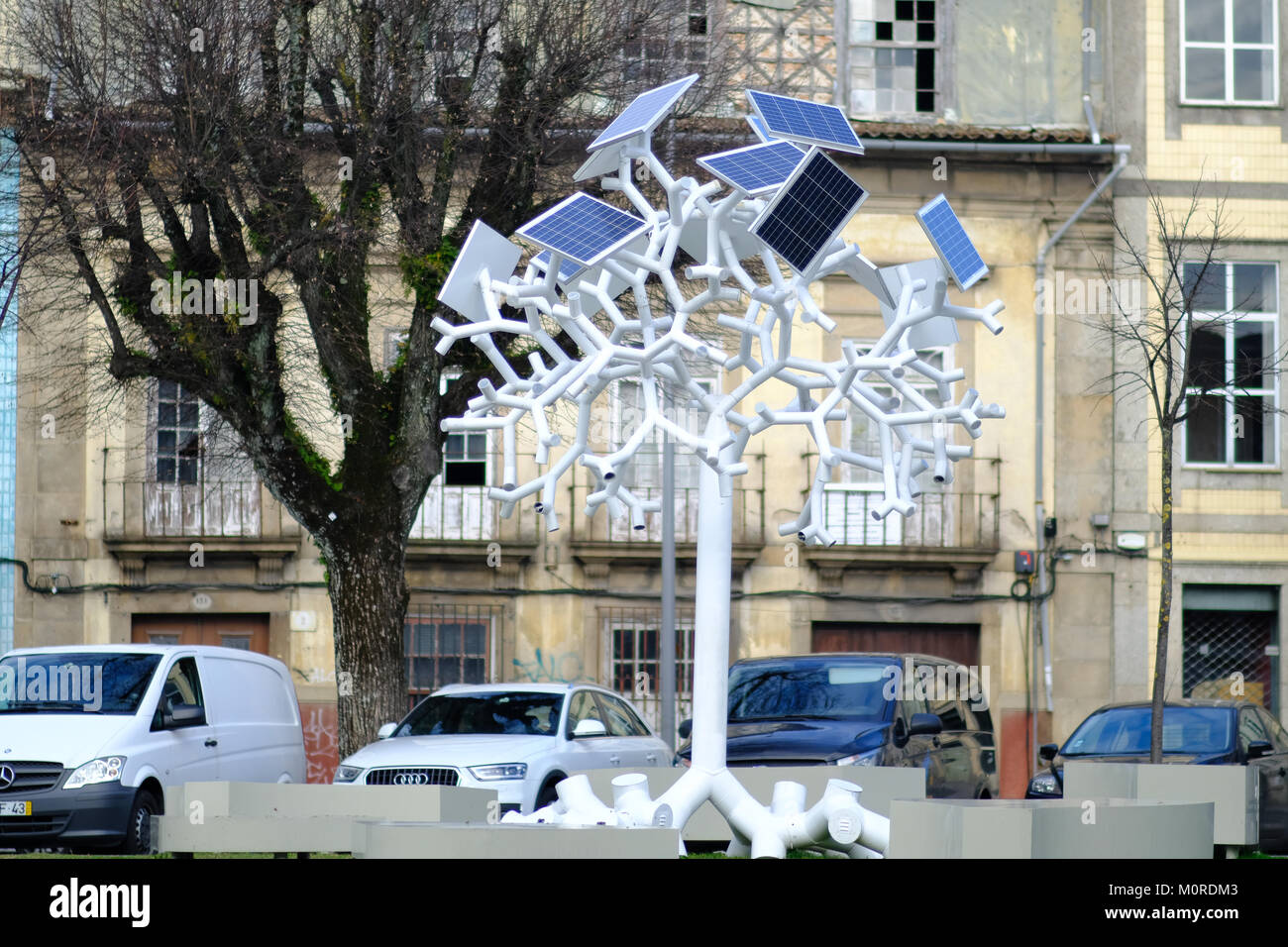 solar panels supply with energy  a tree shaped mobile charger and WiFi antenna in the main square of Braga, a city in the north of Portugal Stock Photo