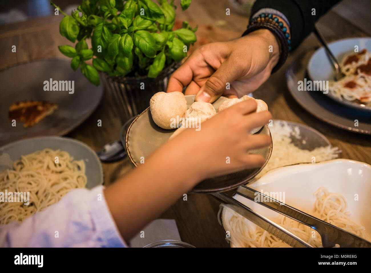 Hand serving bread rolls Stock Photo Alamy