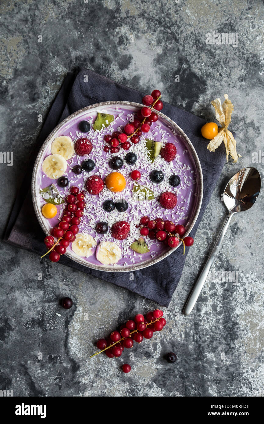 Yogurt with fruits, blueberry, red currants, raspberry, kiwi, banane ...