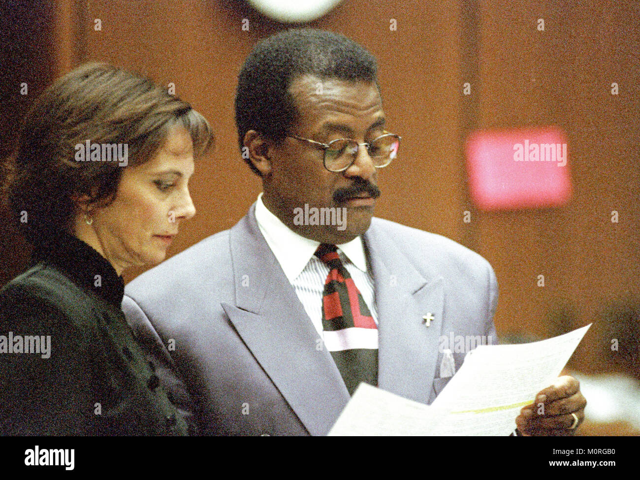 Lead defense attorney Johnnie L. Cochran, Jr., right, and prosecutor Marcia Clark confer during the trial of former NFL star running back O.J. Simpson for the murder of his former wife, Nicole Brown Simpson and a friend of hers, restaurant waiter, Ron Goldman in Los Angeles County Superior Court in Los Angeles, California on July 13, 1995. Credit: Steve Grayson / Pool via CNP /MediaPunch Stock Photo