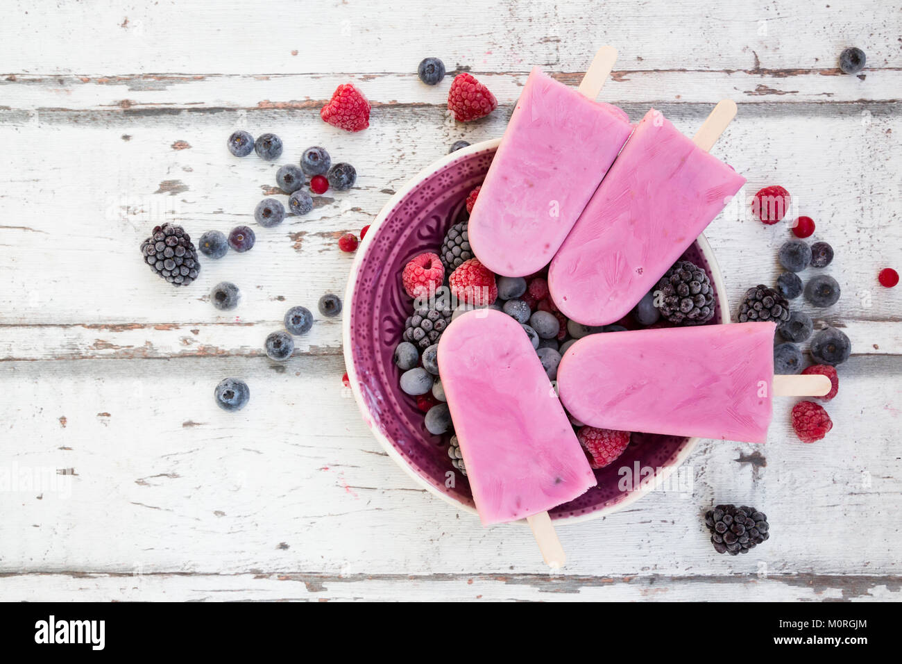 Homemade wild-berry ice lollies with raspberries, blueberries, red ...