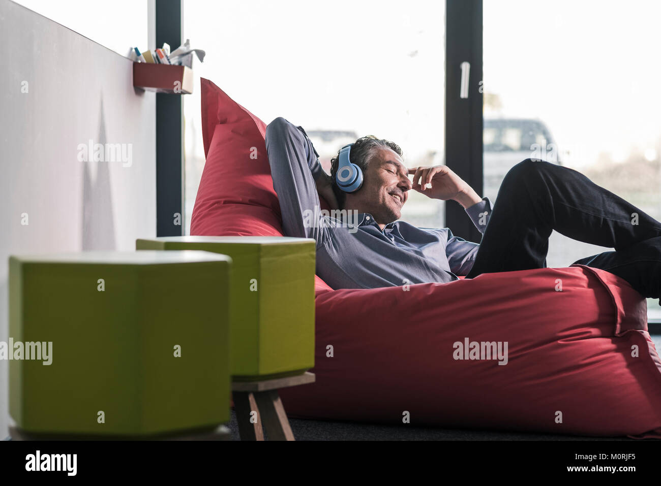 Man sitting on beanbag hi-res stock photography and images - Alamy