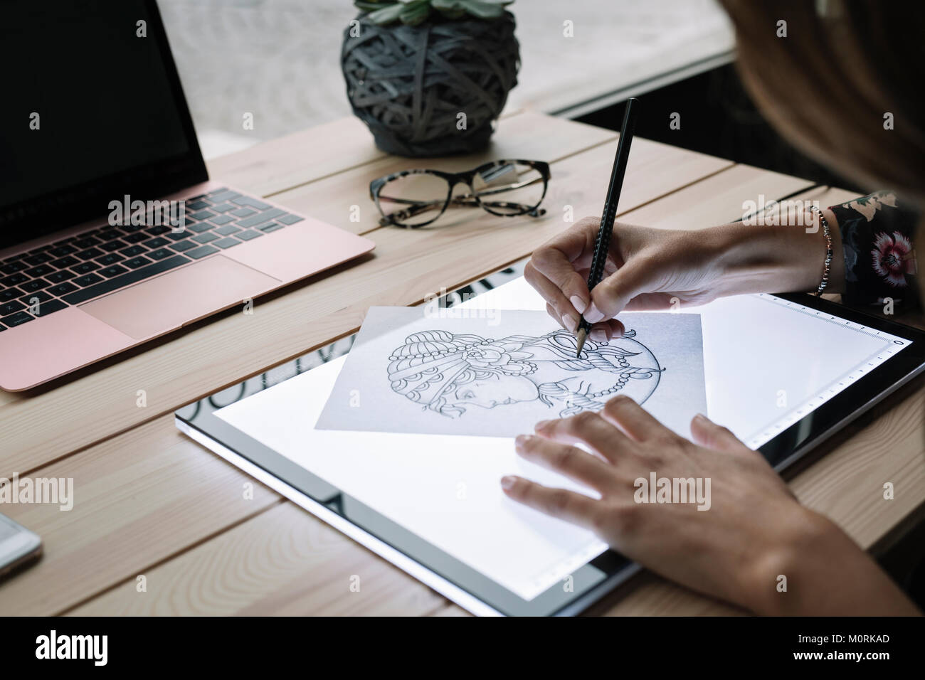 Woman S Hand Drawing Template On Light Table Stock Photo
