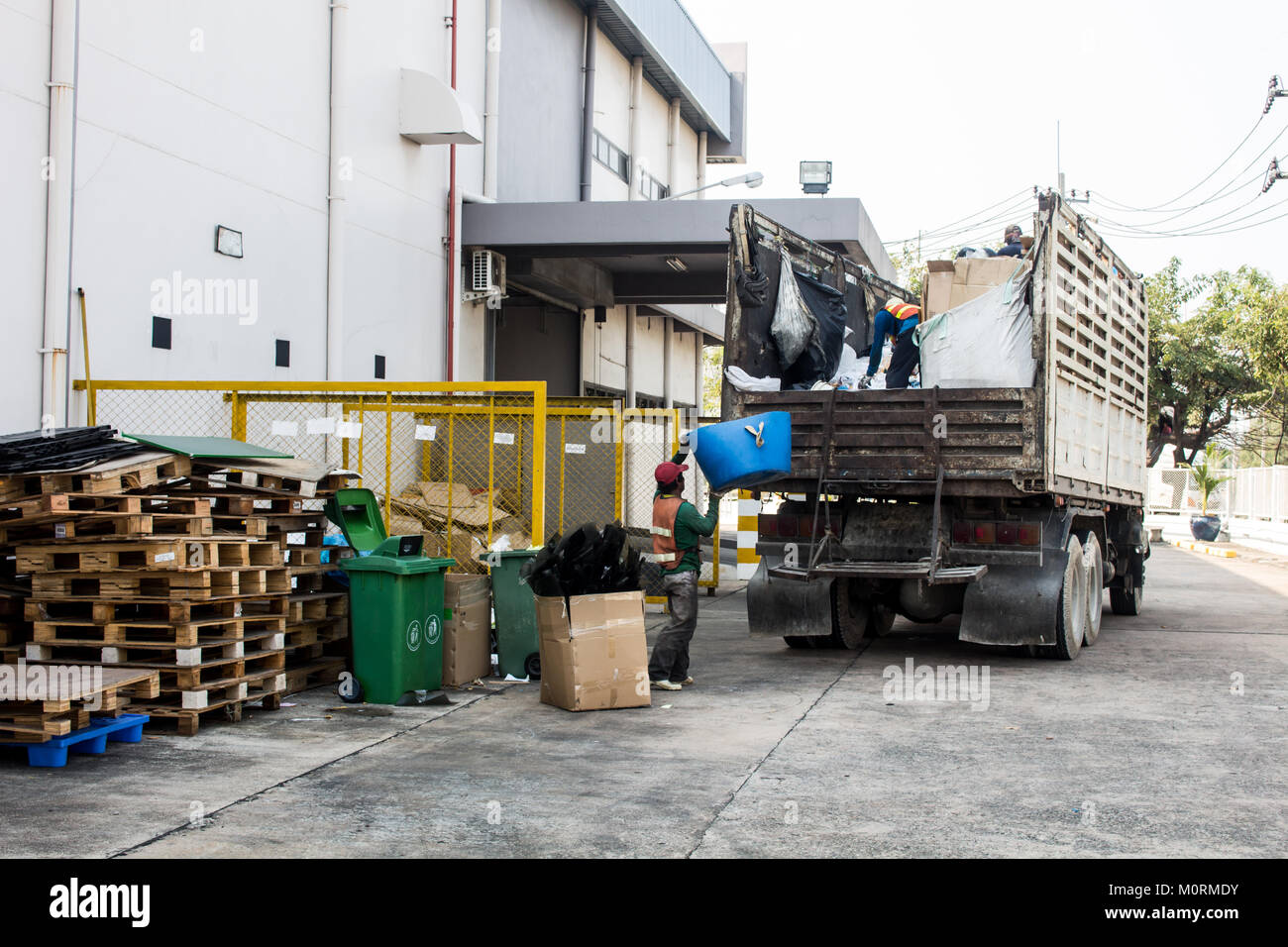 Waste Management, The garbage truck with worker Stock Photo