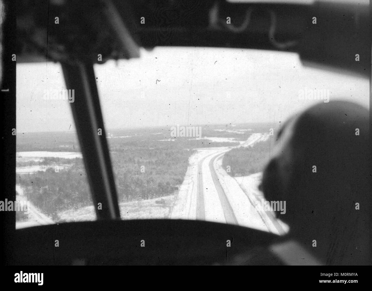 Governor Jimmy Carter and Maj. Gen. Joel B. Paris, Georgia's Adjutant General view storm impacts from a Georgia Army National Guard UH-1 helicopter following a winter storm that struck the state February 9, 1973. Stock Photo