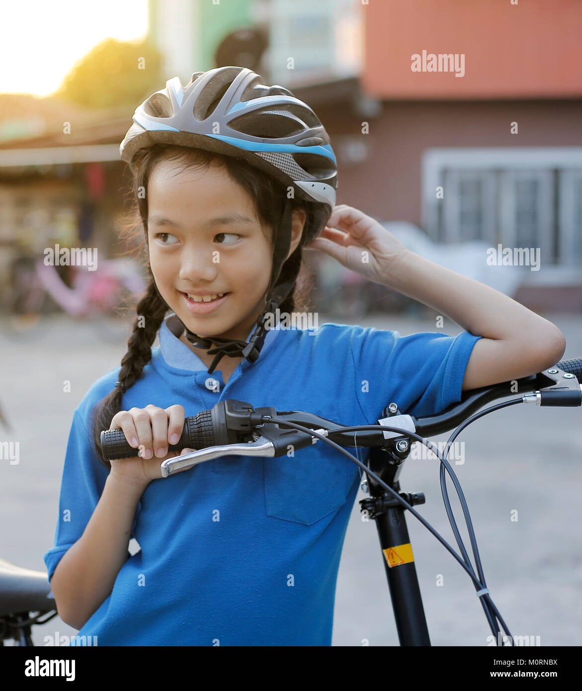 child girl with folding bike. Stock Photo