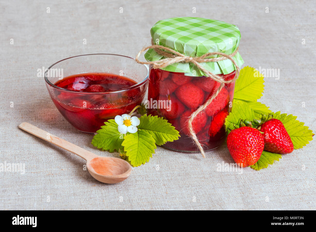 Fresh red strawberry and jam on textile background Stock Photo - Alamy