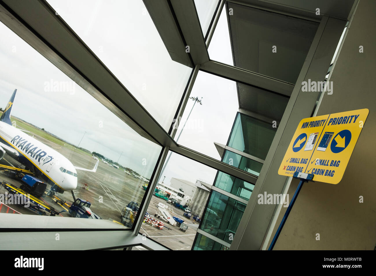 New Ryanair signage with the categories for boarding with cabin baggage, priority, non priority, cabin bags, restrictions, at departure gates in Dubli Stock Photo