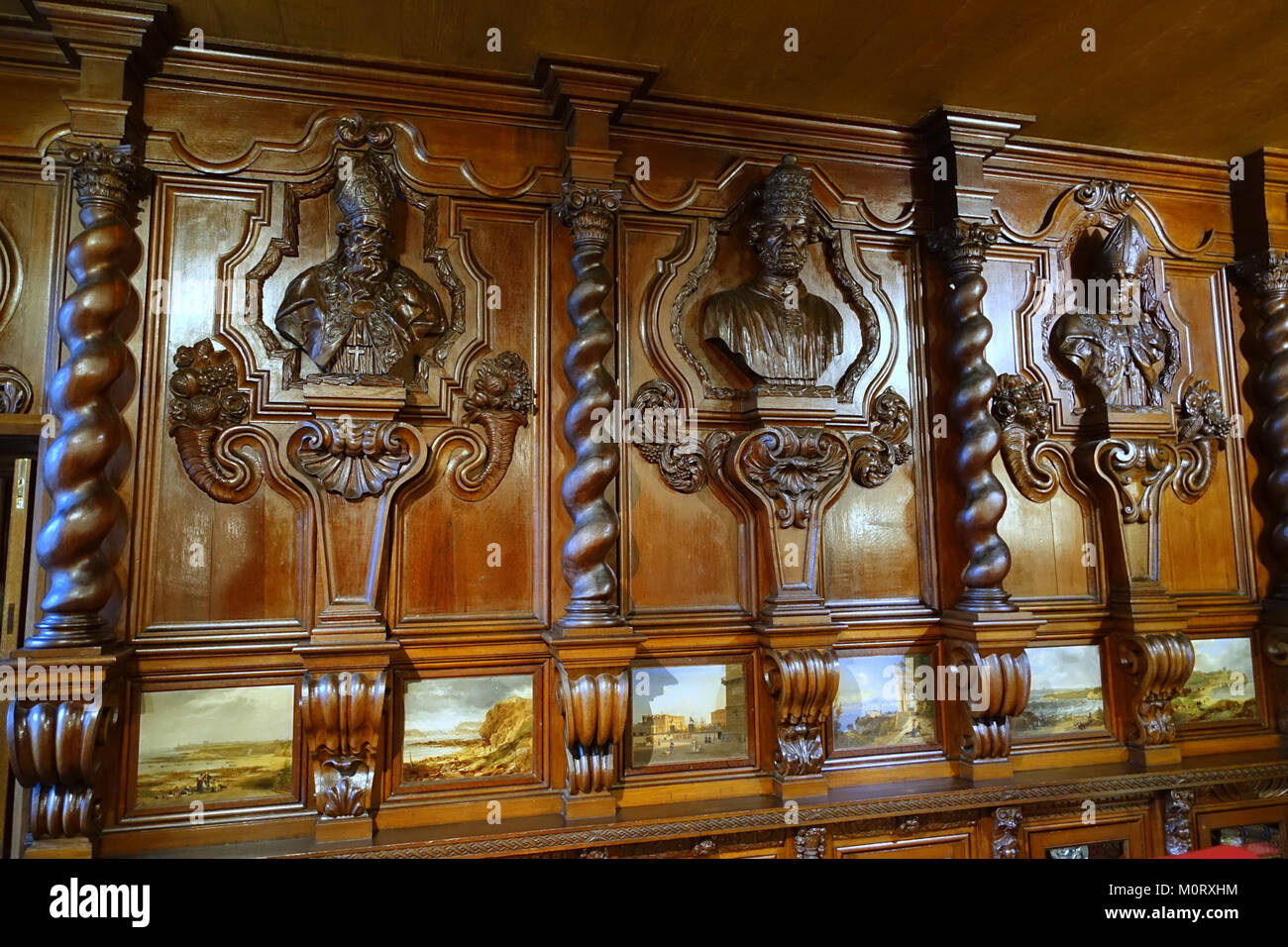 Carved busts and panelling from a German monastery, acquired 1837, with paintings by John Wilsom Carmichael - Oak Room, Chatsworth House - Derbyshire, England - DSC03044 Stock Photo