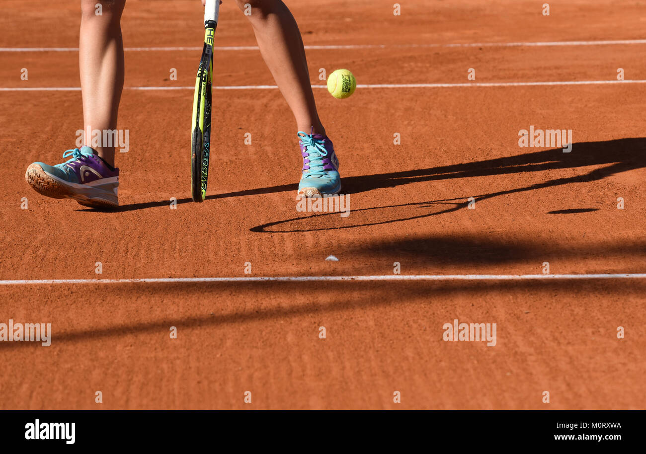 images of details of a women's tennis match, a tennis player hits the