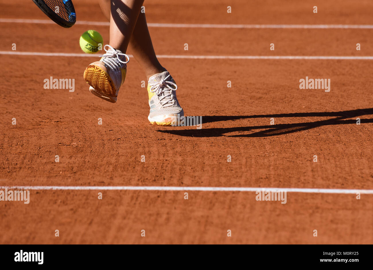 images of details of a women's tennis match, a tennis player hits the