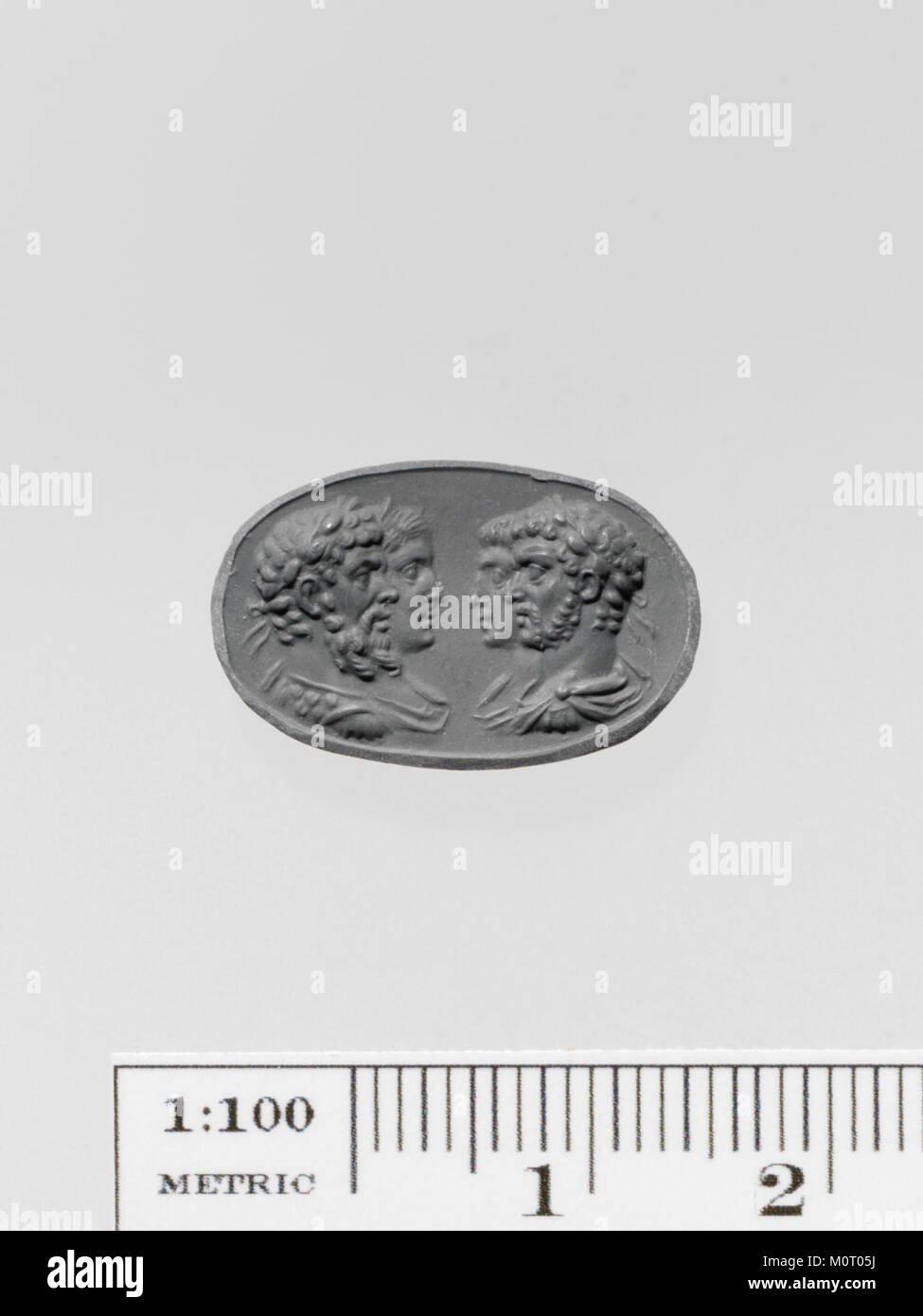 A carnelian ring stone, part of the Metropolitan Museum of Artâ€™s collection, featuring a carved design that dates back to ancient times, showcasing craftsmanship in gem engraving. Stock Photo