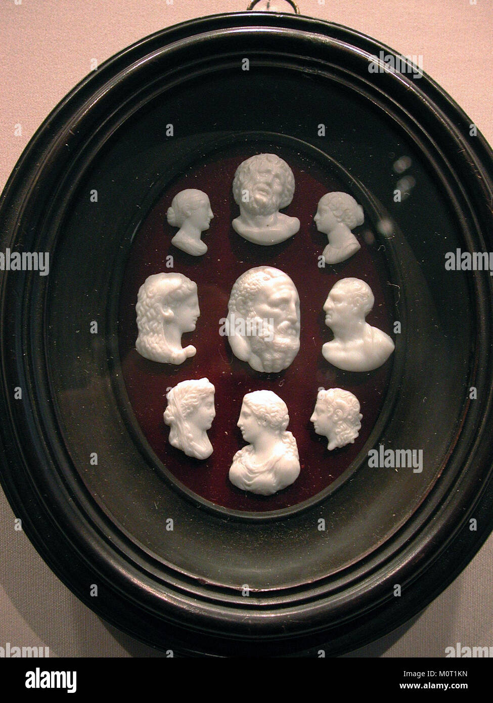 This photograph features casts made from antique gems, showcasing intricate and detailed reproductions of historical artwork. The collection of casts is part of the MET SF10 33 6b exhibit, which includes fine craftsmanship in ancient gem art. Stock Photo