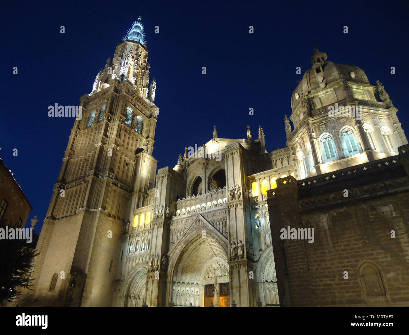 A Stunning Nighttime View Of Toledo Cathedral In Spain Showcasing Its a-stunning-nighttime-view-of-toledo-cathedral-in-spain-showcasing-its