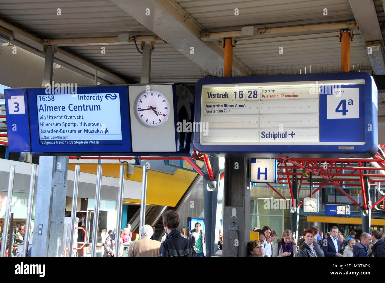 This image shows a digital train information board at Utrecht Centraal Station in 2011. It displays train schedules and platform details, a crucial element of modern station infrastructure for passengers. Stock Photo
