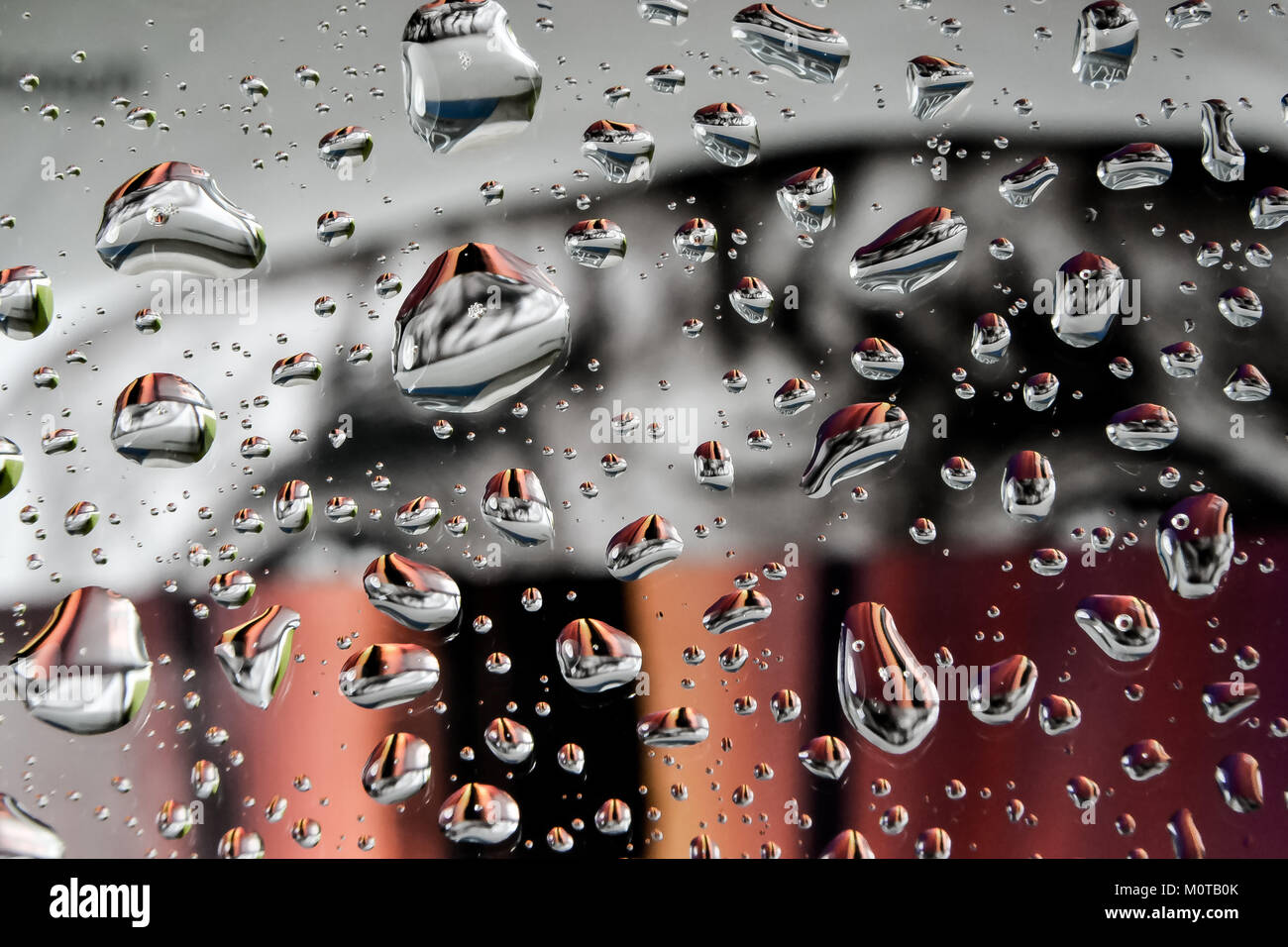 Perfect Rain Drops on Colorful Glass Stock Photo - Alamy