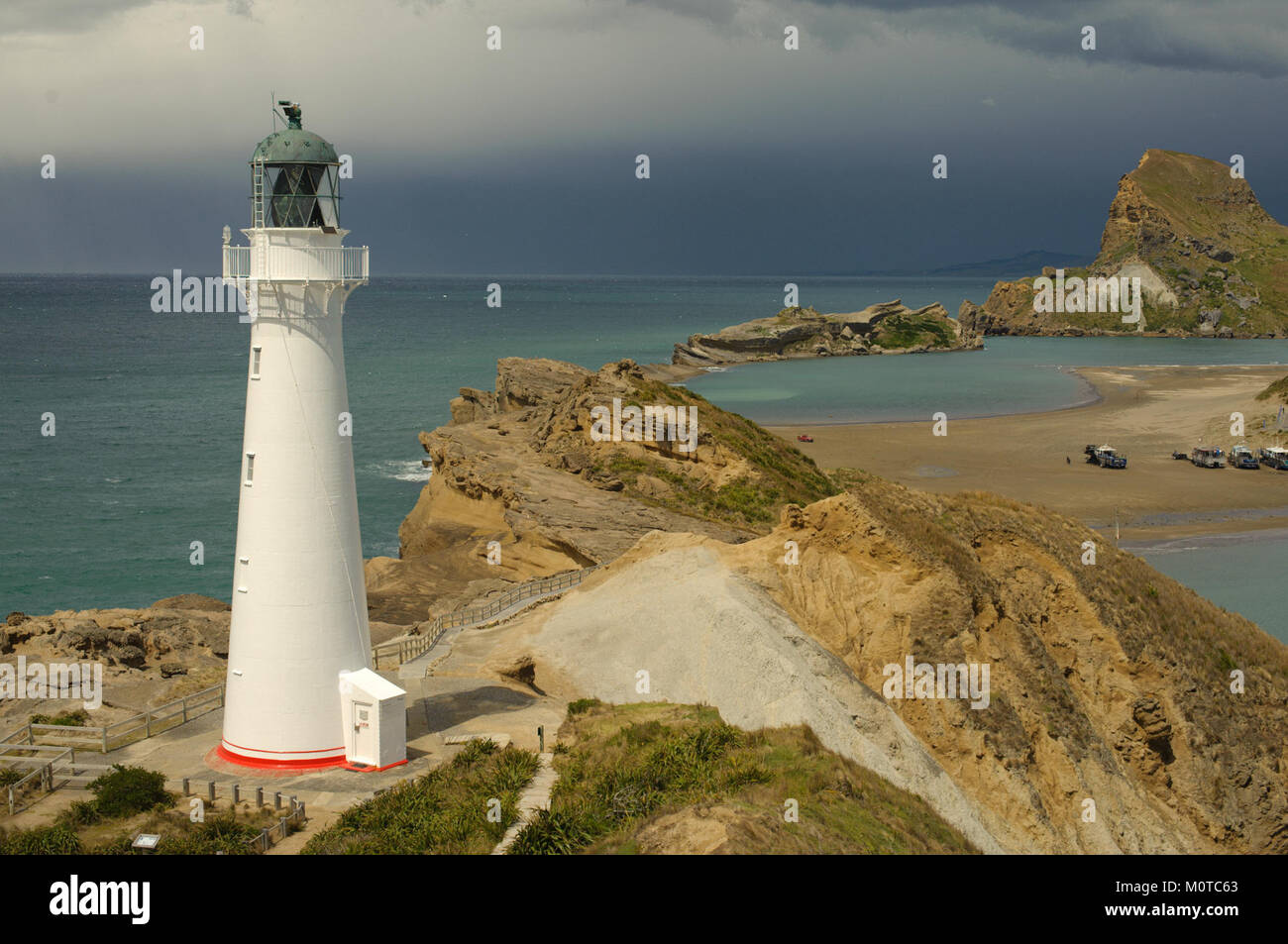 Castlepoint Lighthouse, located on the coast of New Zealand, is an ...