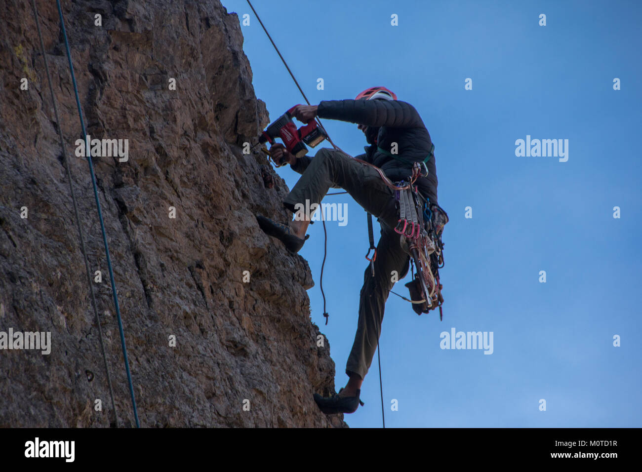 climber bolting a new route Stock Photo Alamy