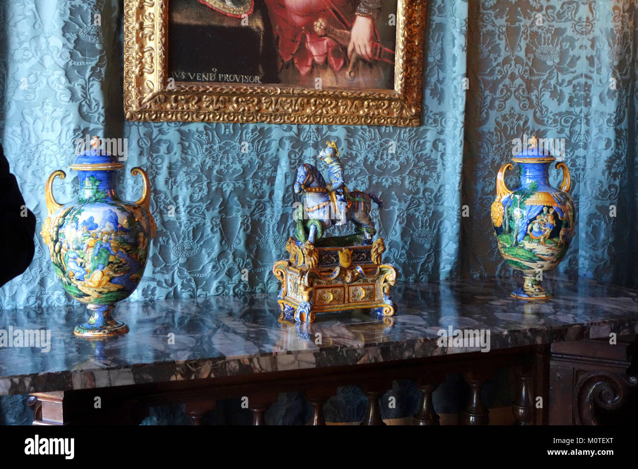 This photograph showcases ceramics displayed in the Doge's Suite of Hearst Castle, a historic California landmark. The ceramics represent fine craftsmanship and art in a historic setting. Stock Photo