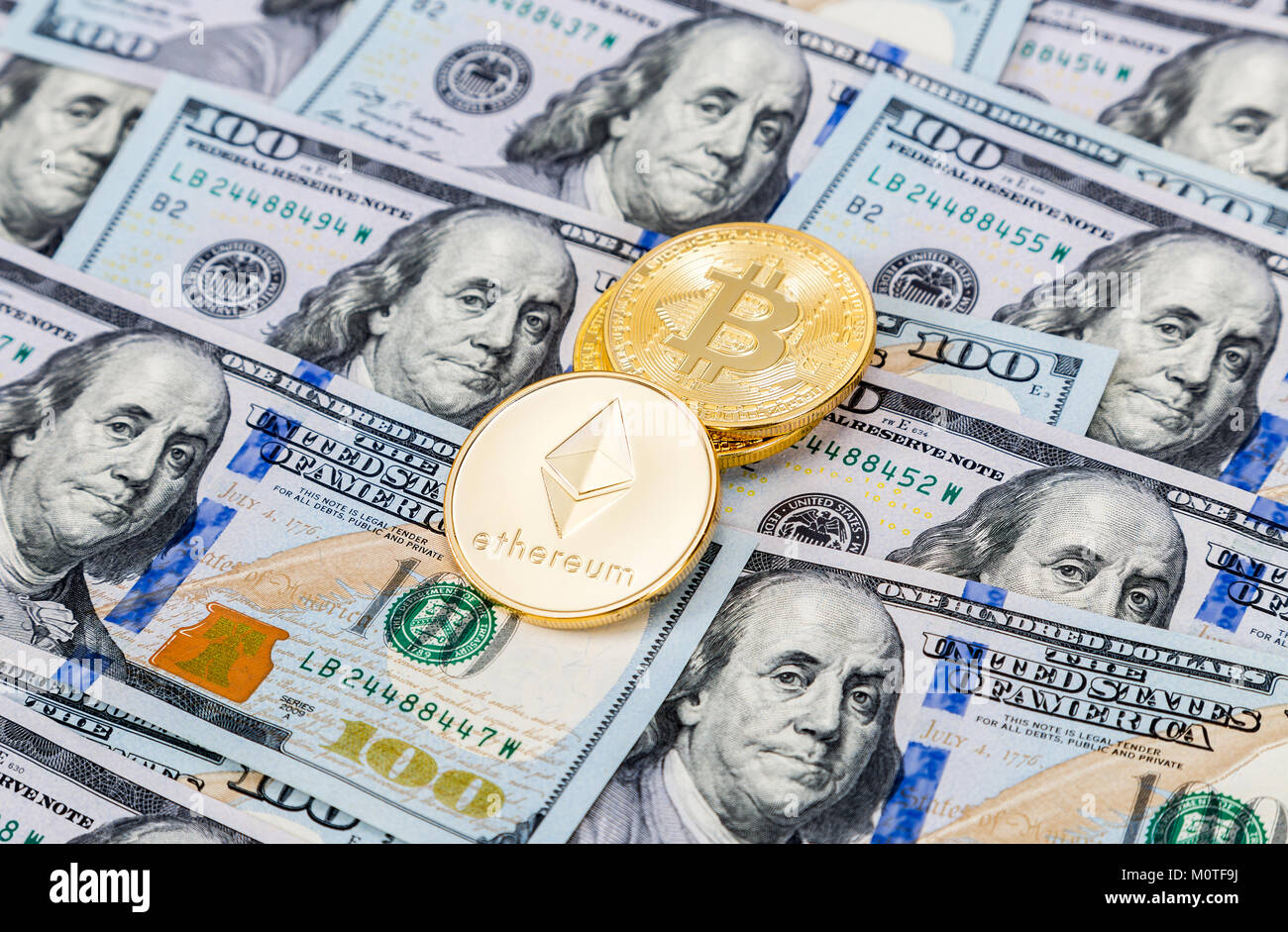 Digital cryptocurrency Bitcoin and Ethereum lying on the one hundred  american dollar bills. Business concept of new virtual money Stock Photo -  Alamy