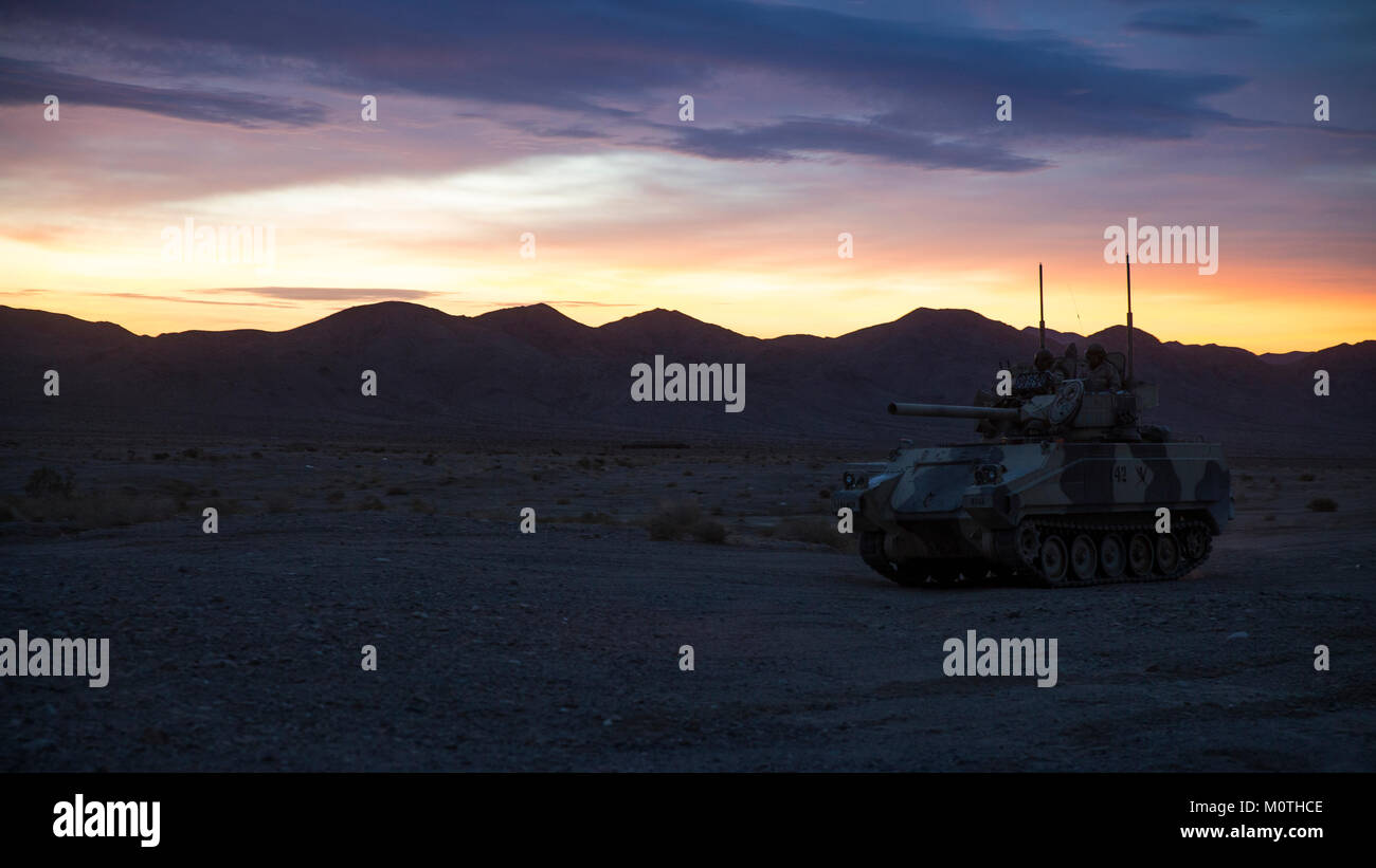 A U.S. Army M113 Armored Personnel Carrier travels through the dessert during a field training exercise at the National Training Center (NTC) in Fort Irwin, Calif., Jan. 16, 2018. Stock Photo