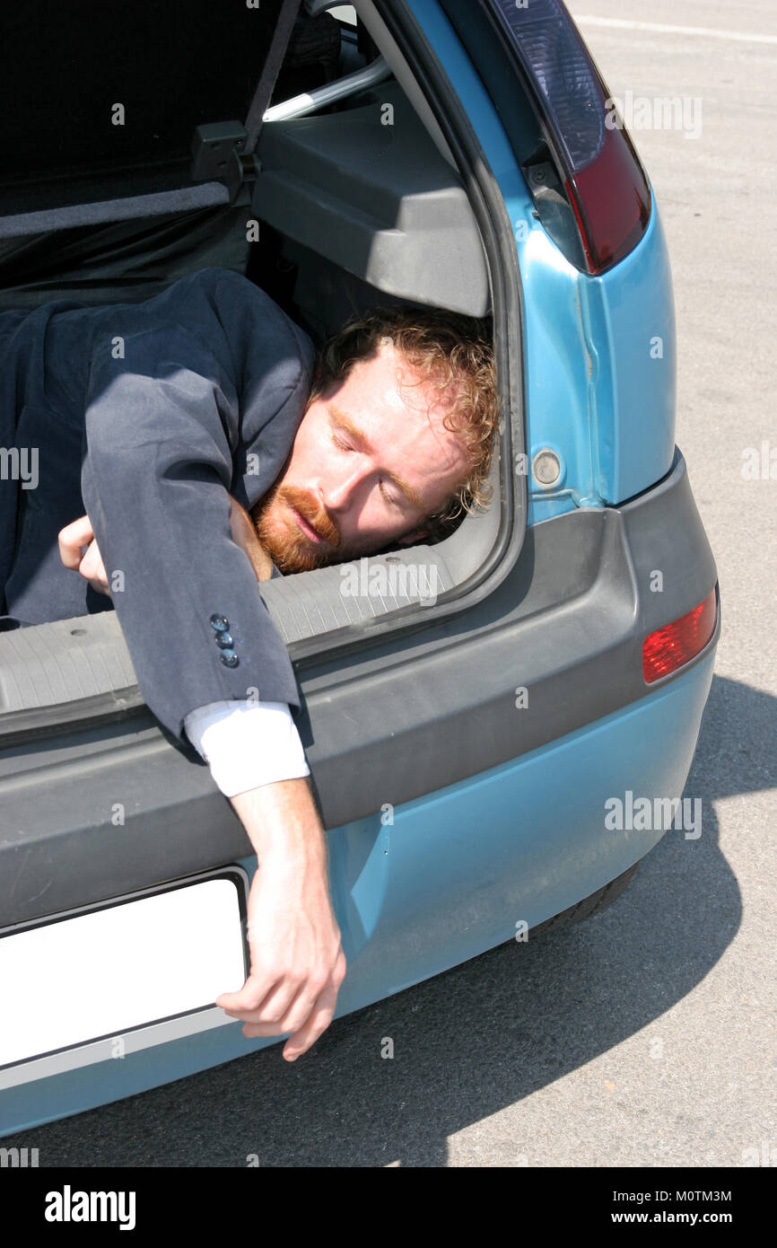 Dead man in car boot Stock Photo Alamy