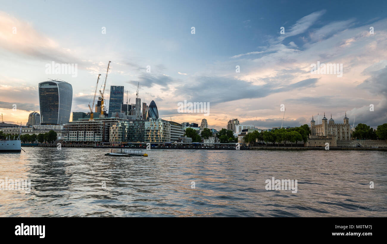 The Tower of London and skyscrapers of the City of London with Thames in foreground, London, may 2017 Stock Photo
