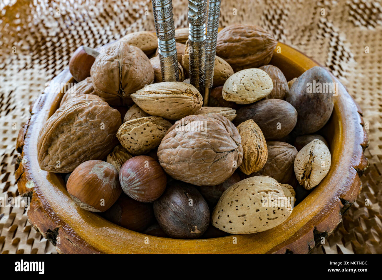 artisan bowl with mixed nuts and nutcracker Stock Photo Alamy