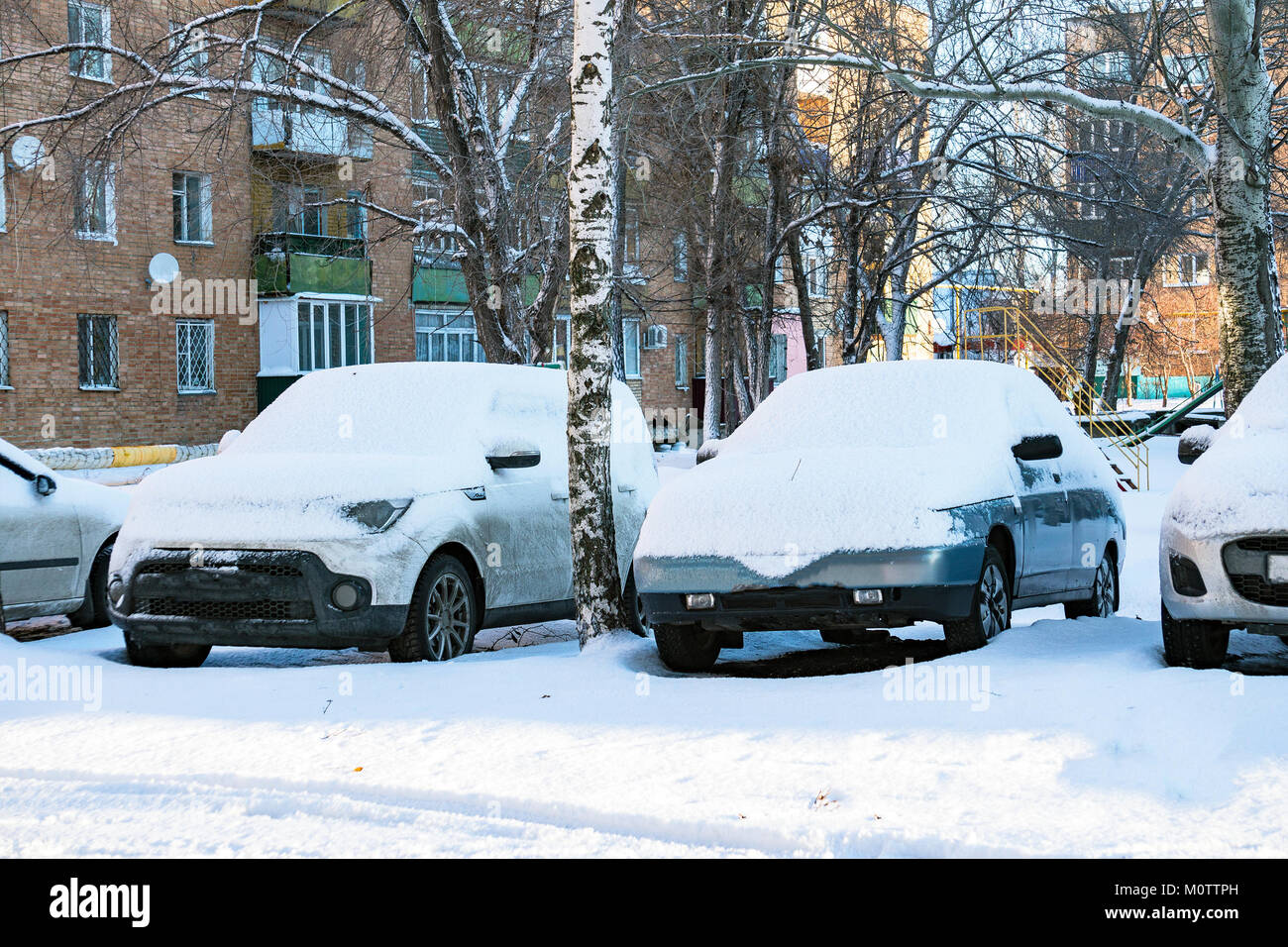 Parked cars covered with snow Stock Photo - Alamy