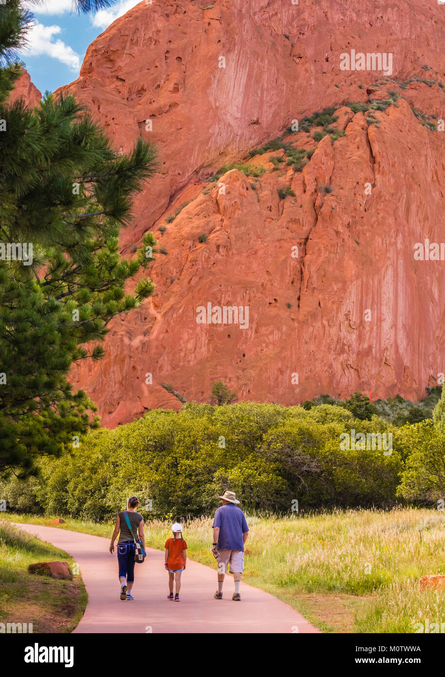 Senior man, young woman and a girl walking around the Garden of the Gods park, Colorado Springs, Colorado Stock Photo