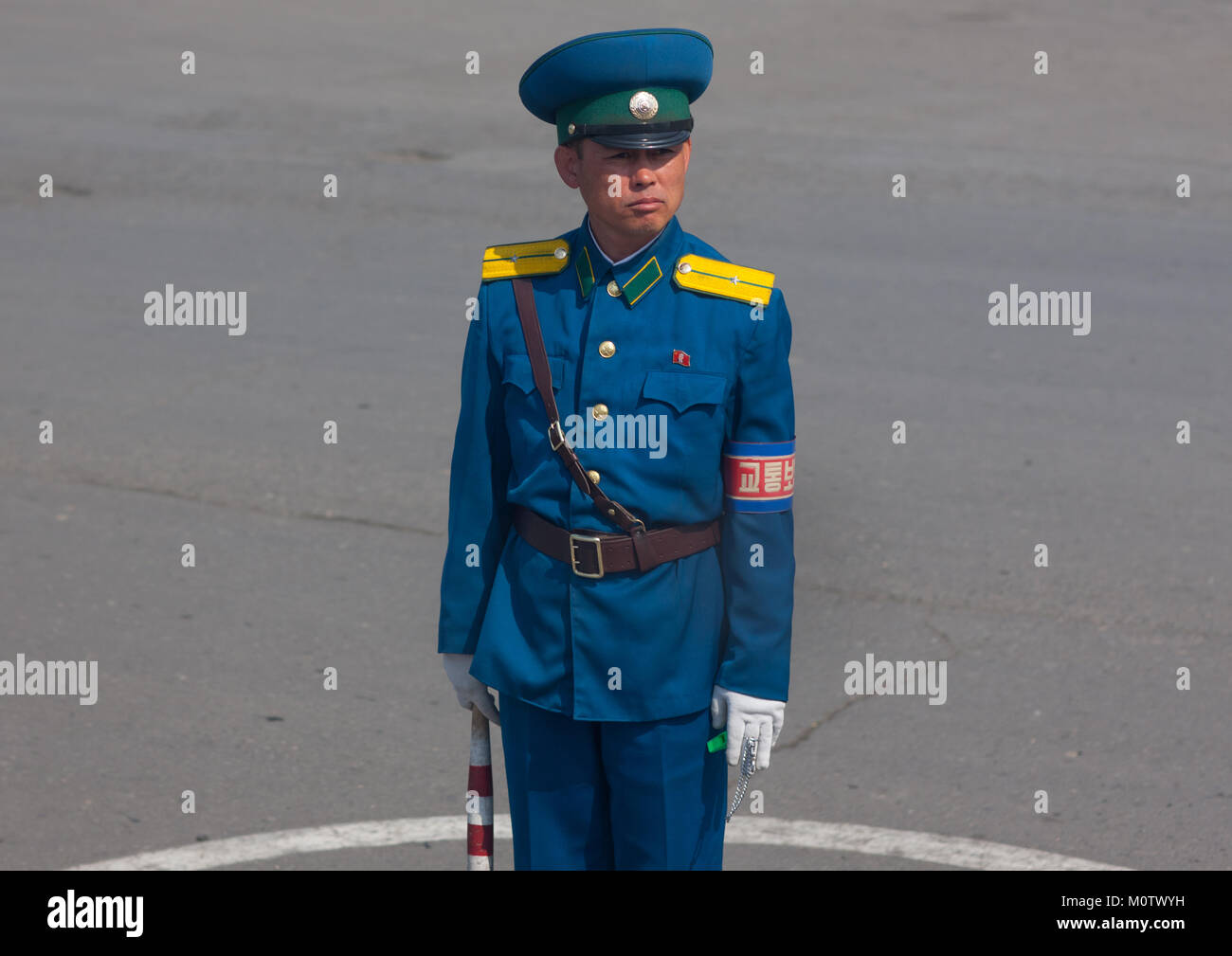 North Korean male traffic security officer in blue unform in the street,  South Pyongan Province, Nampo, North Korea Stock Photo - Alamy