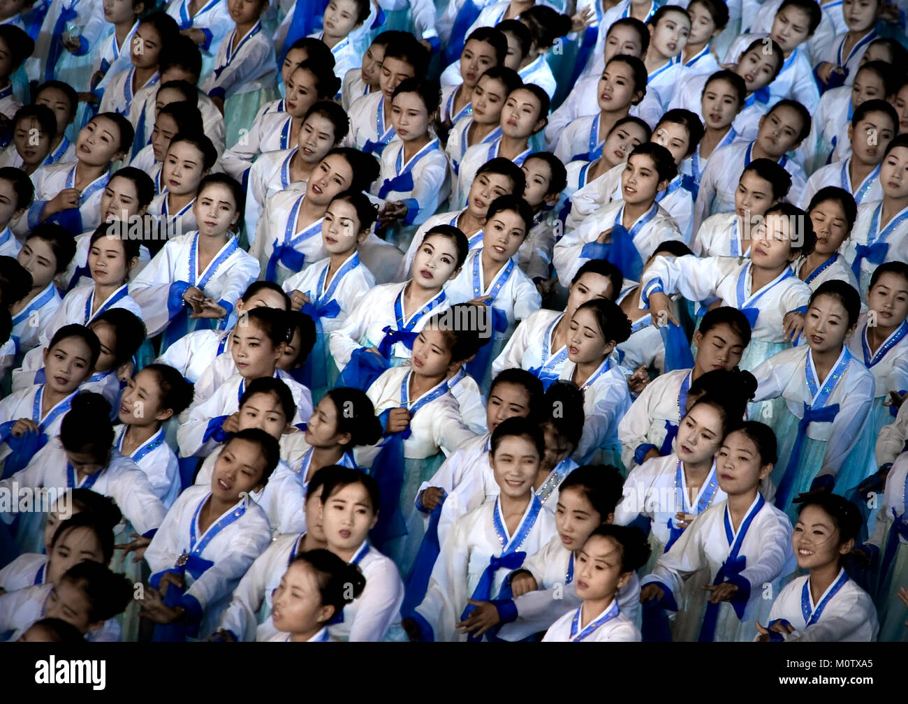 North Korean women dancing in choson-ot during the Arirang mass games in may day stadium, Pyongan Province, Pyongyang, North Korea Stock Photo