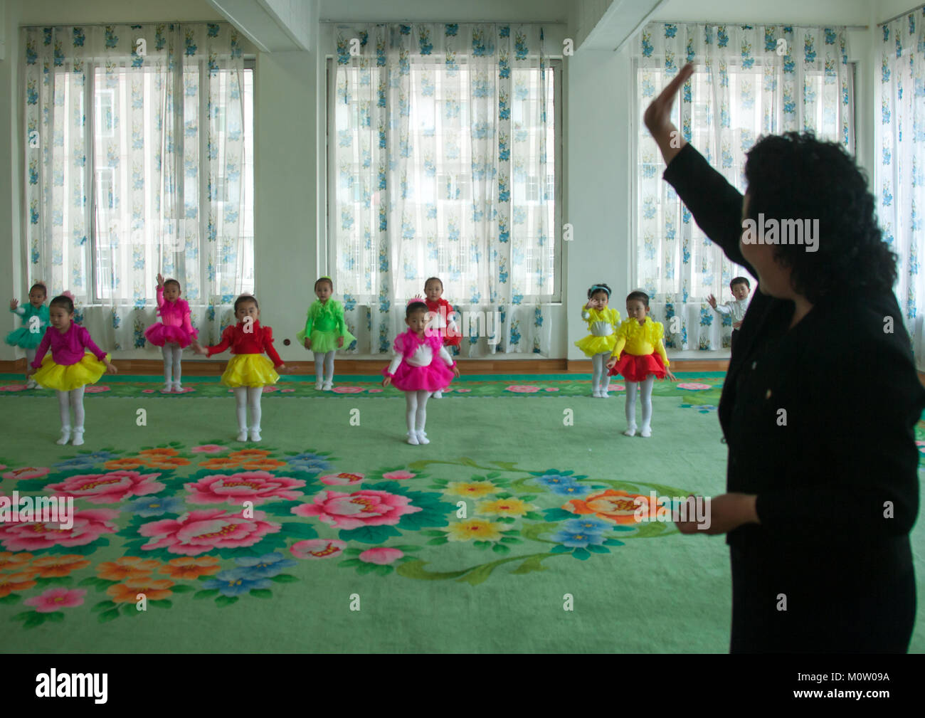 North Korean ballet dancers children in Kim Jong suk school with their teacher, Pyongan Province, Pyongyang, North Korea Stock Photo