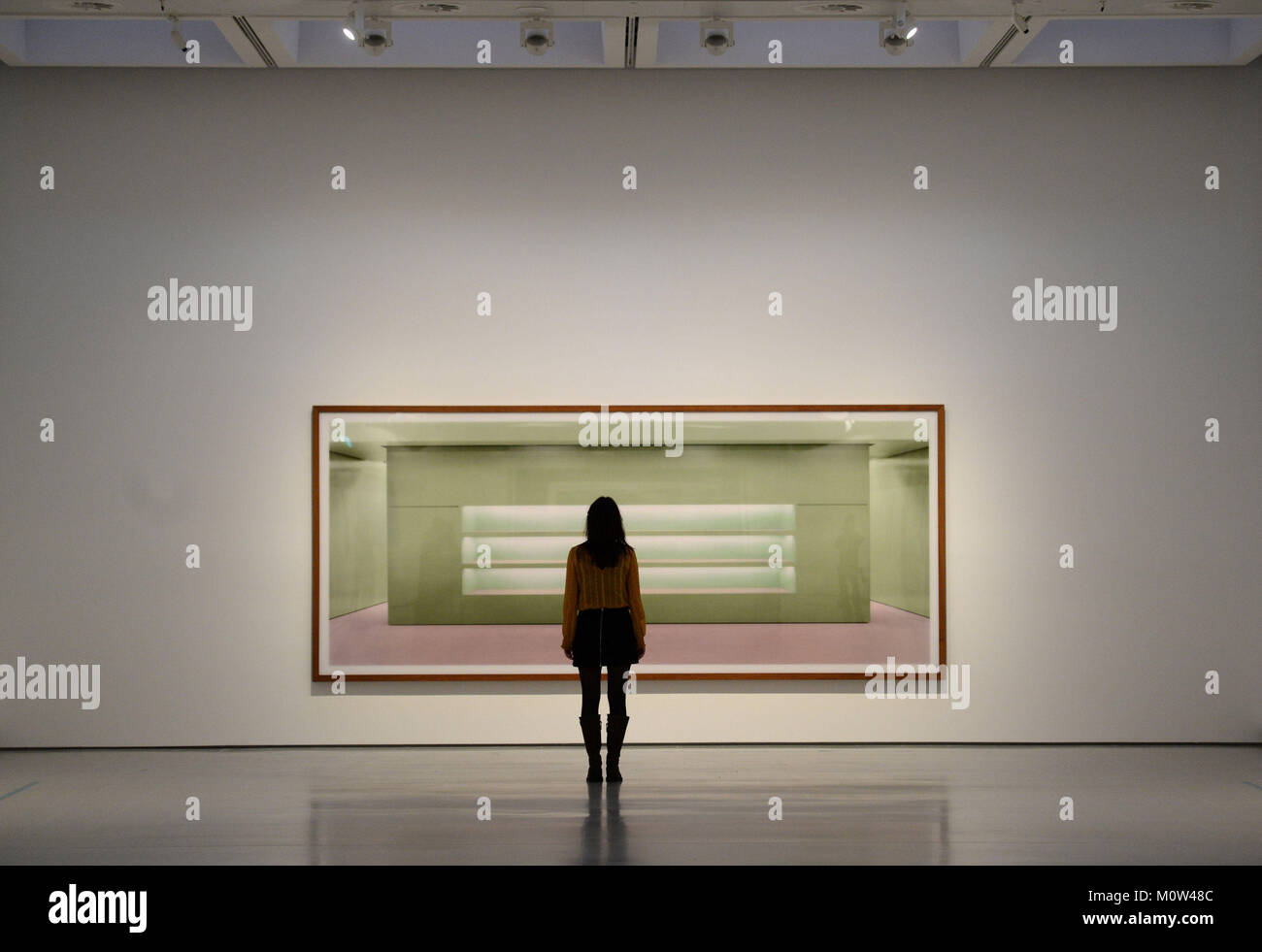 A visitor looks at Prada II by Andreas Gursky, at the Hayward Gallery in  London after the gallery reopens with a major retrospective of work by the  German photographer Stock Photo -