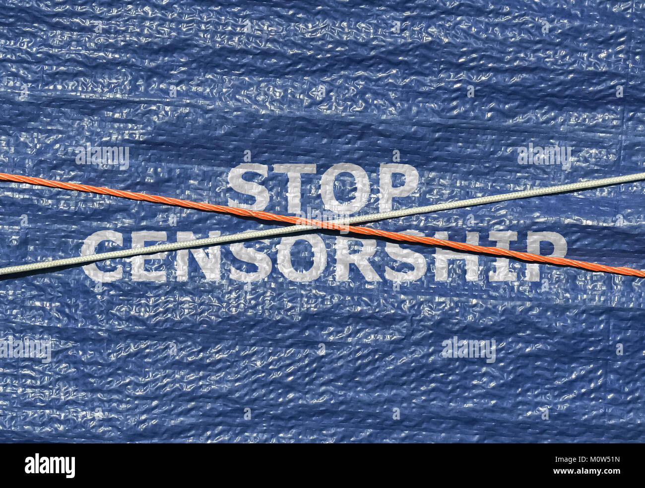 Text Stop Censorship written on blue background with rope over it Stock Photo